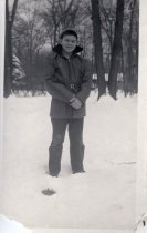 An Arden SHore boy standing in the snow, December 1957